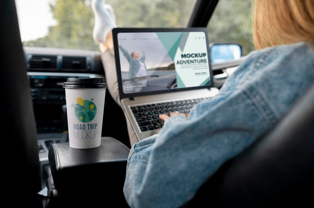 Traveler Holding A Mock-Up Laptop Psd