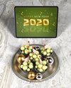 Tray With Chocolate Beside Tablet With New Year Message Psd
