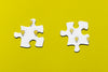 Two Puzzle Pieces On Yellow Background Psd