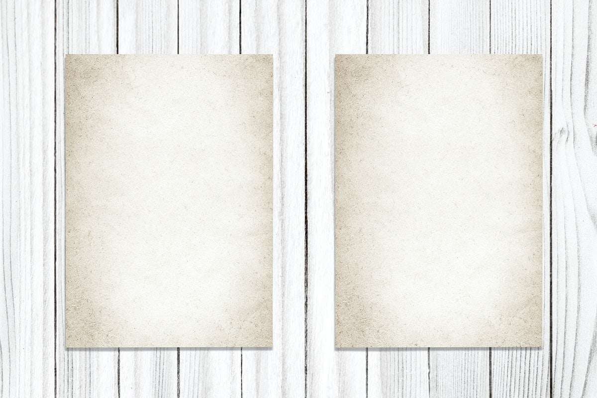 Two Vintage Papers On A Wooden Background
