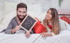 Valentine Mockup With Couple In Bed Showing Slate Psd
