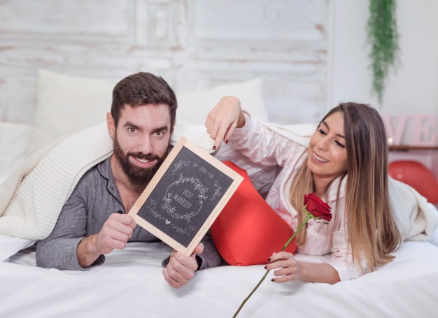 Valentine Mockup With Couple In Bed Showing Slate Psd