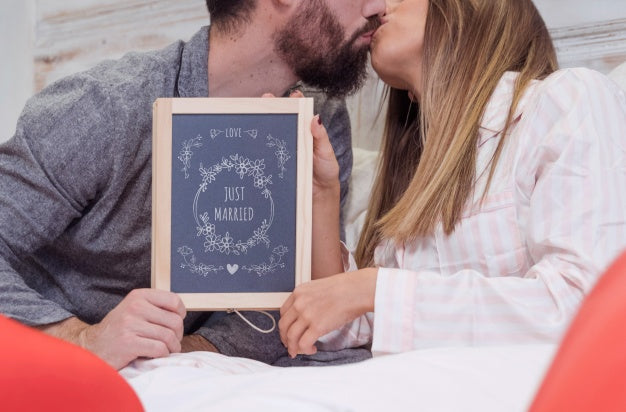 Valentine Mockup With Couple In Bed Showing Slate Psd