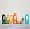 Variety Of Colourful Bottles Of Organic Fruit Juice Psd