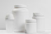 Various White Containers With Protein Powder Psd