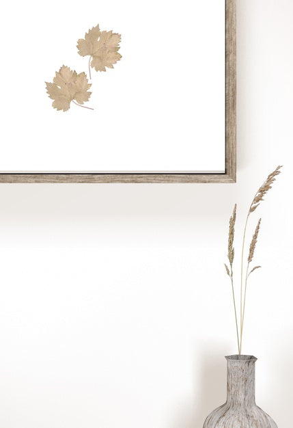 Vase With Flowers And Wall Frame With Leaves Psd