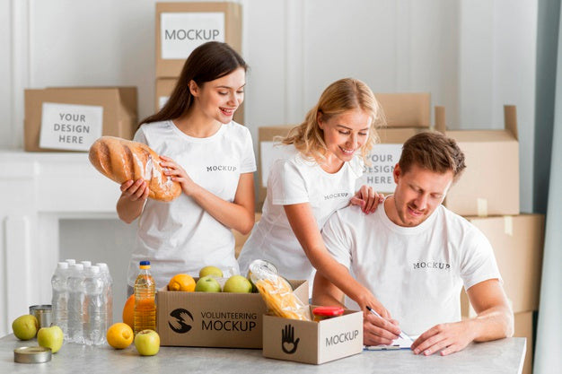 Volunteer Writing Down Food For Donation Boxes Psd