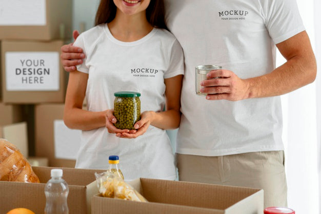 Volunteers Posing Together While Preparing Boxes Of Provisions For Donations Psd