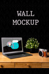 Wall Mock-Up With Camera And Laptop Psd