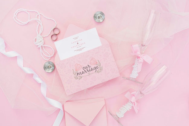 Wedding Decoration In Pink Tones With Envelope And Glasses Of Champagne Psd