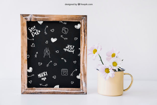 Wedding Decoration With Slate And Flowers In Mug Psd