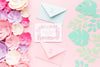 Wedding Invitation Mock-Up And Envelopes With Paper Flowers On Pink Background Psd