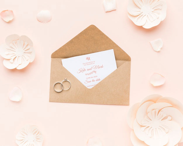 Wedding Rings And Invitation Mock-Up With Paper Flowers And Petals Psd