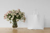 White Bag And Flowers In A Vase Psd
