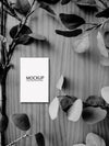 White Card Mockup On Black And White Wooden Table Psd