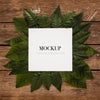 White Frame For Mockup With Border Leaves On Wood Psd