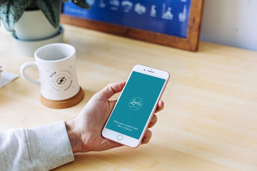 White iPhone 8 Mockup in Man’s Hand