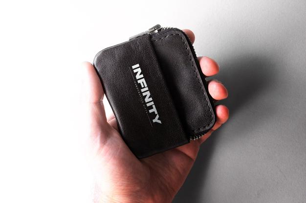 White Logo Mockup On A Leather Wallet Psd