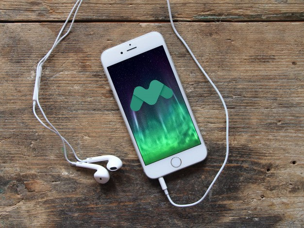 White iPhone 7 on Wooden Table Psd Mockup