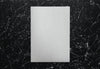 White Paper On A Black Marble Background