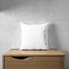 White Pillowcase Mockup On A Wooden Furniture Psd