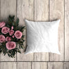 White Pillowcase Mockup On A Wooden Plank With Decorative Roses Psd