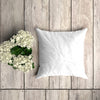 White Pillowcase Mockup On A Wooden Plank With Floral Decoration Psd