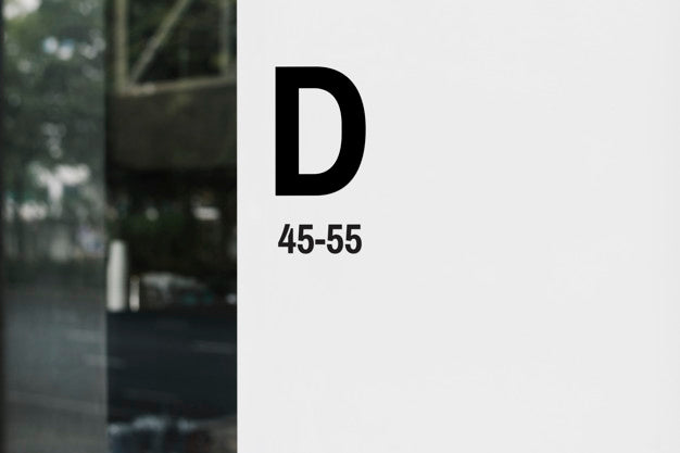 White Signboard Mockup On A Glass Window Psd