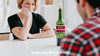 Wine Mockup With Couple At Table Psd