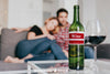 Wine Mockup With Couple On Couch Psd