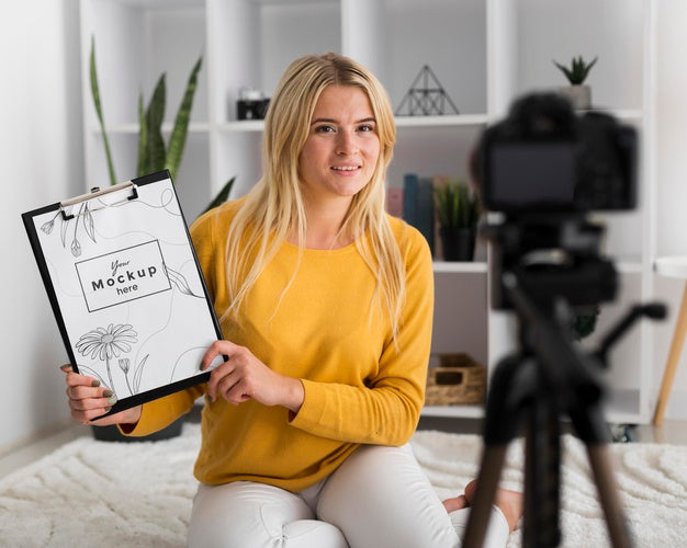 Woman At Home Showing Clipboard Mock-Up Psd