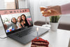 Woman Celebrating At Home With Friends Over Laptop And Drink Psd