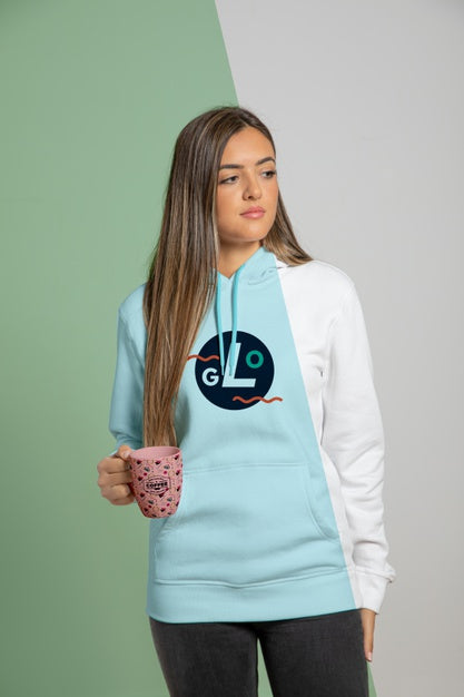 Woman Dressed In Hoodie Holding Mug Psd
