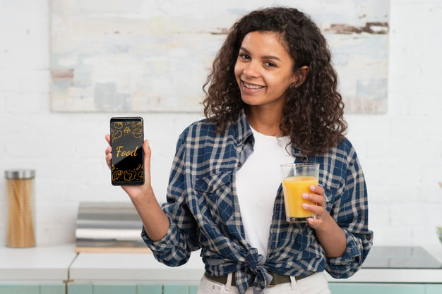 Woman Drinking Fresh Juice At Home Psd