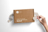 Woman Hand Opening Postal Box With Ribbons Mockup Psd