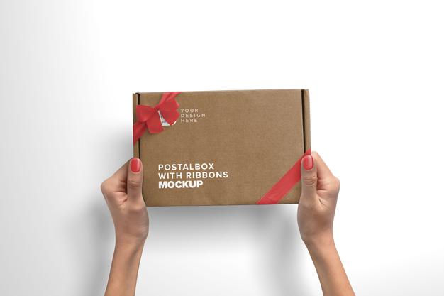 Woman Hands Holding Postal Box With Silk Ribbons Psd