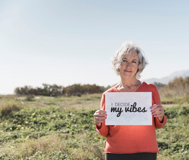 Woman Holding A "I Decide My Vibes" Sign Psd