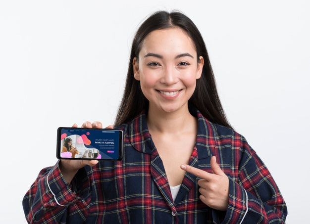 Woman Holding A Landing Page Mock-Up Phone Psd