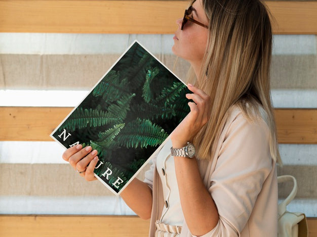 Woman Holding A Magazine And Looking Away Mock Up Psd