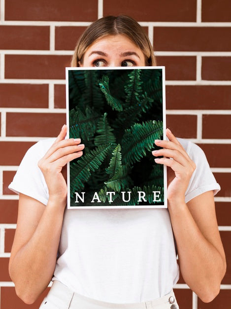 Woman Holding A Magazine And Looking Away Mock Up Psd