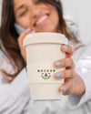 Woman Holding A Mock-Up Cup Of Coffee Psd