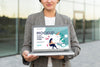 Woman Holding A Mock-Up Laptop For Work Psd