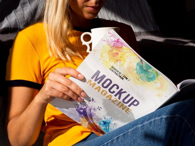 Woman Holding A Mock Up Magazine And A Mug Psd