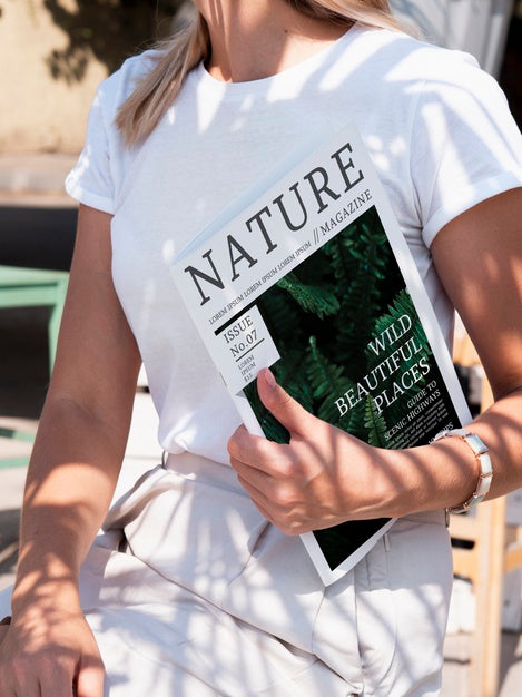 Woman Holding A Nature Magazine Mock Up Psd
