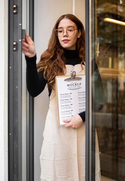 Woman Holding A Restaurant Menu Mock-Up Psd