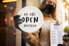Woman Holding A Restaurant We Are Open Sign Psd