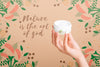 Woman Holding A Skin Lotion Mock-Up Psd