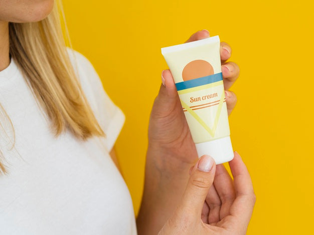 Woman Holding A Sun Cream Bottle Psd