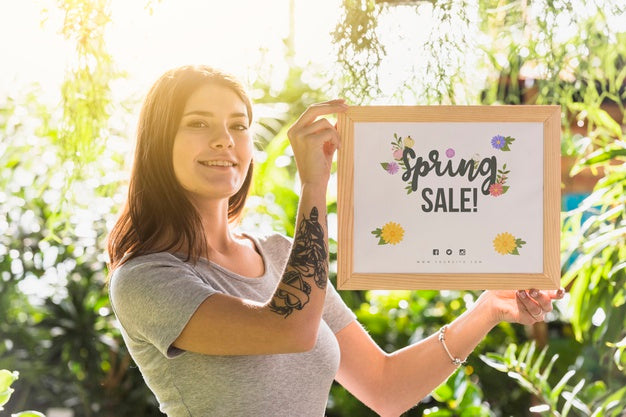Woman Holding Board Mockup For Spring Sale Psd