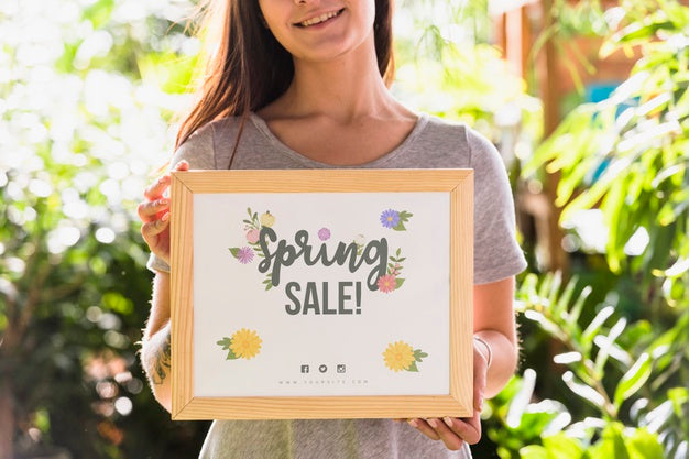 Woman Holding Board Mockup For Spring Sale Psd